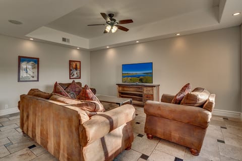 - Cozy living room with plush sofas  
- Large flat screen TV for movie nights  
- Mountain cabin retreat with family lounge