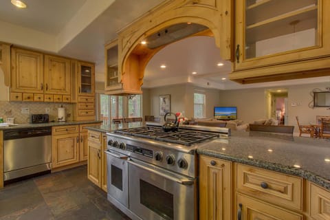 - Stainless steel double oven range  
- Granite countertops and wood cabinets  
- Fully stocked kitchen in mountain lodge