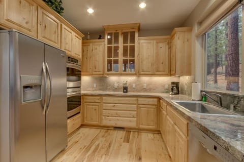 - Fully equipped kitchen with stainless appliances  
- Granite counters and custom wood cabinetry  
- Tahoe cabin with everything for home cooked meals