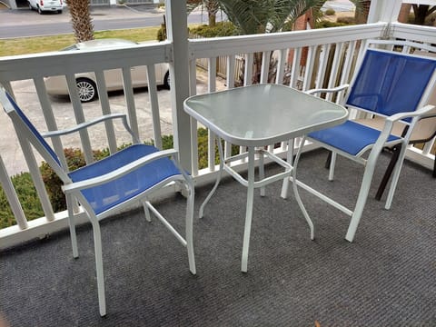 new addition - hi top table and chairs on balcony