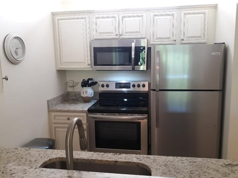 Full Kitchen with Granite Counters and Stainless Steel Appliances