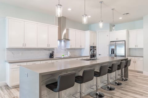 Grand center island with seating for 6 people. *Pantry is not for guest use.