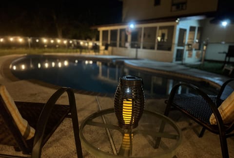 Imagine yourself on a wooded lot relaxing by the pool!