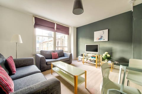 Apartment (1 Bedroom) | Living area | 24-inch flat-screen TV with cable channels