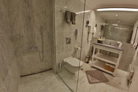 Shower, designer toiletries, hair dryer, bathrobes