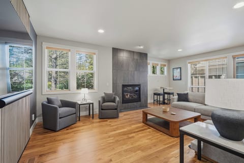 Unwind in your bright, open living space with cozy seating, a warm fireplace, and hardwood floors that invite you to settle in and relax.