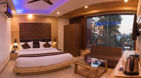 Premium bedding, desk, laptop workspace, iron/ironing board