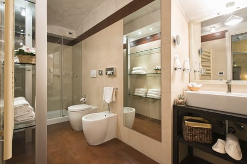 Designer toiletries, hair dryer, slippers, bidet