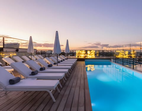 Outdoor pool, open 8:00 AM to 7:00 PM, pool umbrellas, sun loungers
