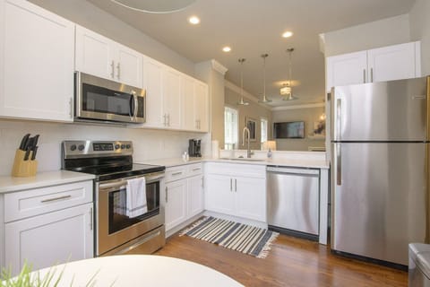 A fully featured kitchen with stainless steel appliances 