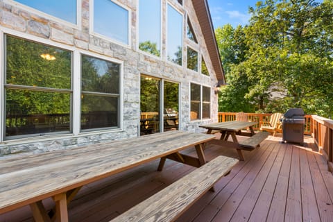 outdoor porch with two picnic tables