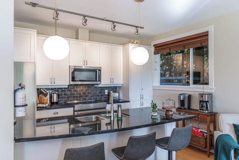 Enjoy the Rathtrevor Provincial Park forest through your kitchen window

