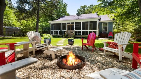 Large private backyard with fire pit and seating