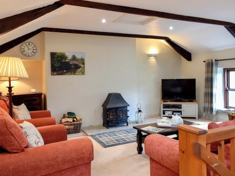 Comfortable living area with a gorgeous wood burner | 2 Swallowholm Cottages, Arkengarthdale, near Reeth