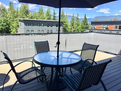 Enjoy sitting on a  large deck with privacy screening!