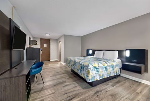 Premium bedding, desk, laptop workspace, blackout drapes