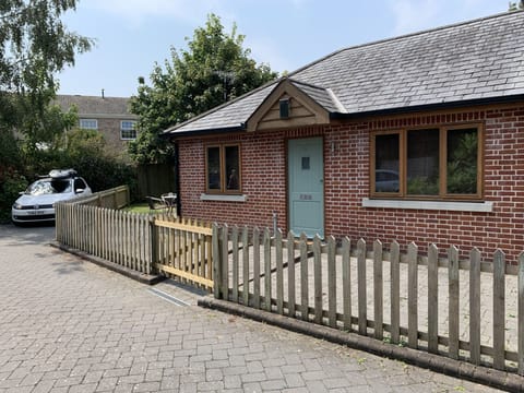 Enclosed patio area and garden to the rear. Parking space adjacent to property.