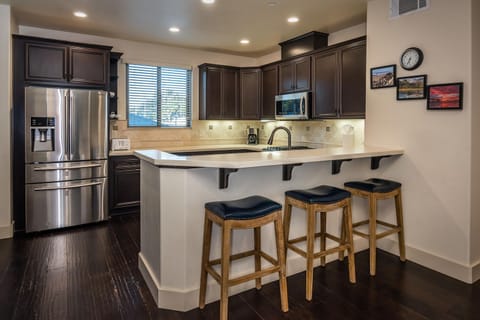 Kitchen has high-end chef grade appliances. Pull up a bar stool and watch your chef prepare meals.