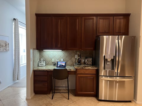 Spacious kitchen with desk area. Walk in panty, all new appliances.