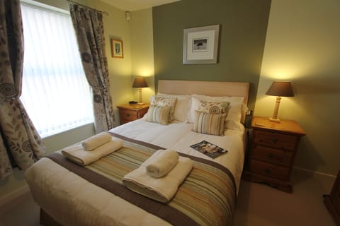 Feature wall above the king size bed in the bedroom