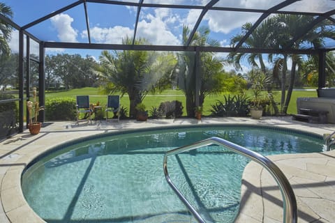 Screened lanai with heated saltwater pool.
