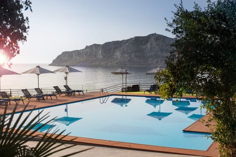 Outdoor pool, open 10:00 AM to 8:00 PM, pool umbrellas, sun loungers