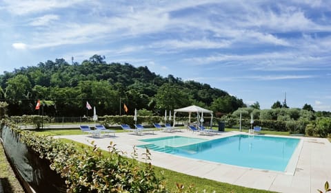 Seasonal outdoor pool, open 7:30 AM to 8:00 PM, pool umbrellas
