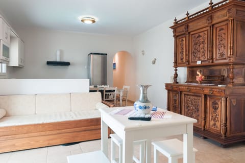 Deluxe Apartment, 2 Bedrooms, Partial Sea View, Poolside | Living area | TV