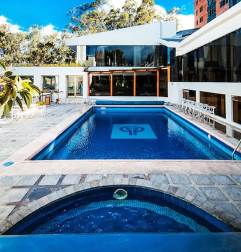 Outdoor pool, pool umbrellas, sun loungers