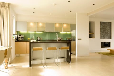 Lodges Self-Catering Garden Area | Private kitchen | Full-size fridge, microwave, oven, stovetop