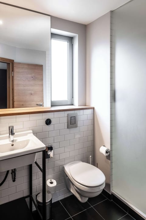 Shower, rainfall showerhead, designer toiletries, hair dryer