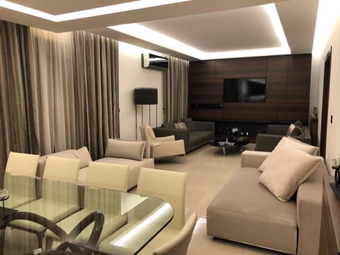 Apartment, 2 Bedrooms | Living area | 60-inch LED TV with satellite channels, TV
