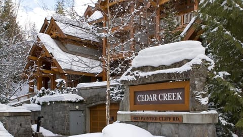 - Snow-covered Cedar Creek lodge offering a true ski-in ski-out mountain escape  
- Nestled among towering pines with cozy alpine charm for winter adventurers  
- Perfect base for Whistler slopes with scenic forest surroundings  