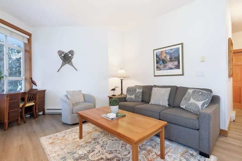 - Cozy living room with warm fireplace and soft lighting for relaxing evenings  
- Plush seating and charming decor create an inviting mountain lodge atmosphere  
- Ideal space to unwind after a day on the slopes or Whistler village exploring  