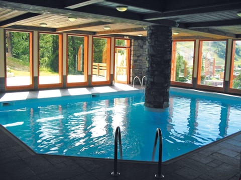 Swim laps in the indoor pool.