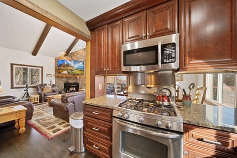 Custom Kitchen with Gas Cooktop and Pass Throughs to the Dining Room