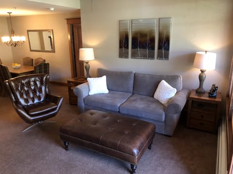 Living room with Pottery Barn furniture.  Sofa opens up to a queen mattress