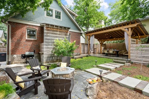 Backyard— gather around the fire pit or beneath the pergola
