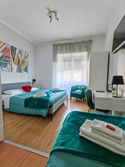Triple Room (Green) | Minibar, in-room safe, individually decorated, individually furnished