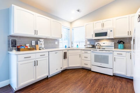 Fully stocked kitchen with all the dishes, pots, pans, blender, toaster, etc.