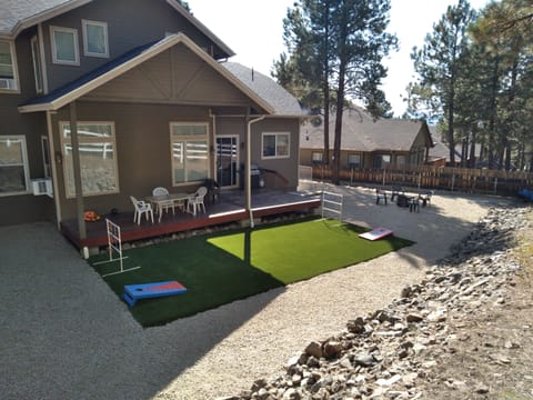 Backyard made for relaxing & fun with games; ladder golf, corn hole, and firepit