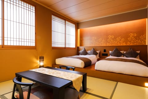 Deluxe Room east building | Down comforters, in-room safe, desk, iron/ironing board (on request)