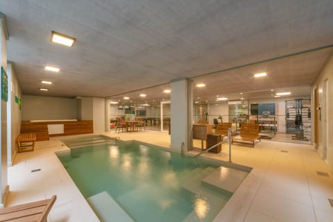 Indoor pool, open 10:00 AM to 10:00 PM, sun loungers