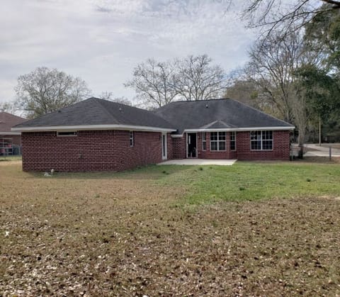 Fenced in back yard view from corner of back yard