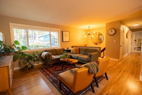 Living Room:  Open floor plan with a 5 person sectional and 55 inch smart tv,