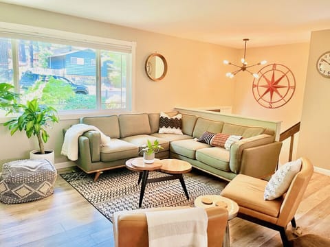 Living Room: Sectional that seats 5 and 2 and leather chairs.