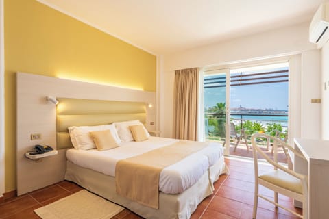 Double Room Sea/Pool View | Minibar, in-room safe, desk, laptop workspace