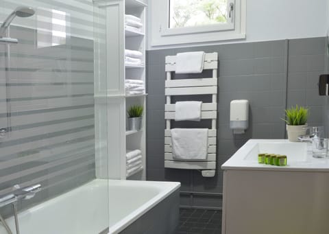 Superior Family Room | Bathroom | Hair dryer, towels, soap, shampoo