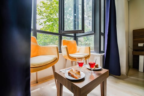 Comfort Suite, 1 Queen Bed, City View | In-room safe, individually decorated, individually furnished