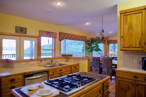 Open format kitchen with island and bar.